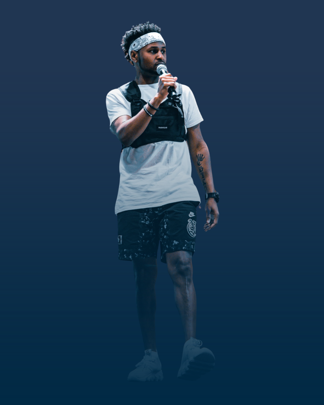 Marcell Johnson on stage with a microphone